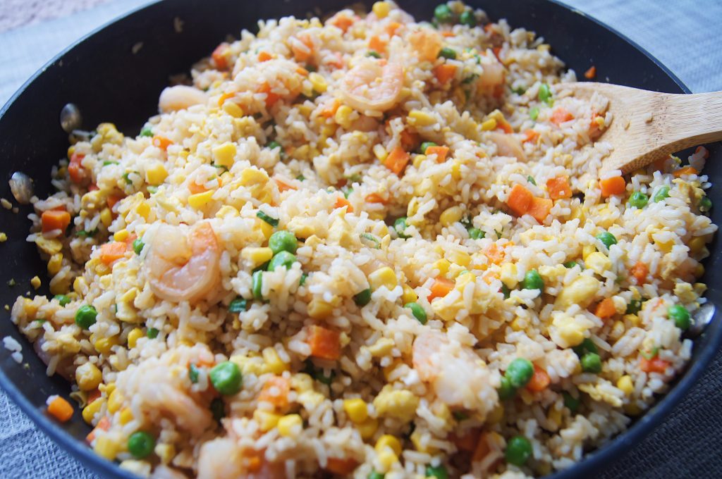 One-Pot-Shrimp-Fried-Rice-01-in-a-skillet-with-wooden-spoon