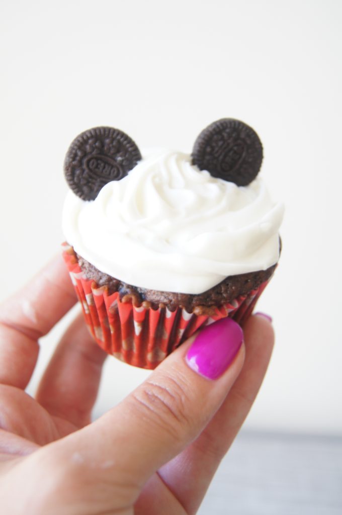 Mickey-Mouse-chocolate-cupcakes-hand-holding-in-air