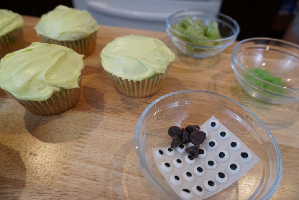 Toy-Story-Alien-Cupcakes-face-toppings-on-table