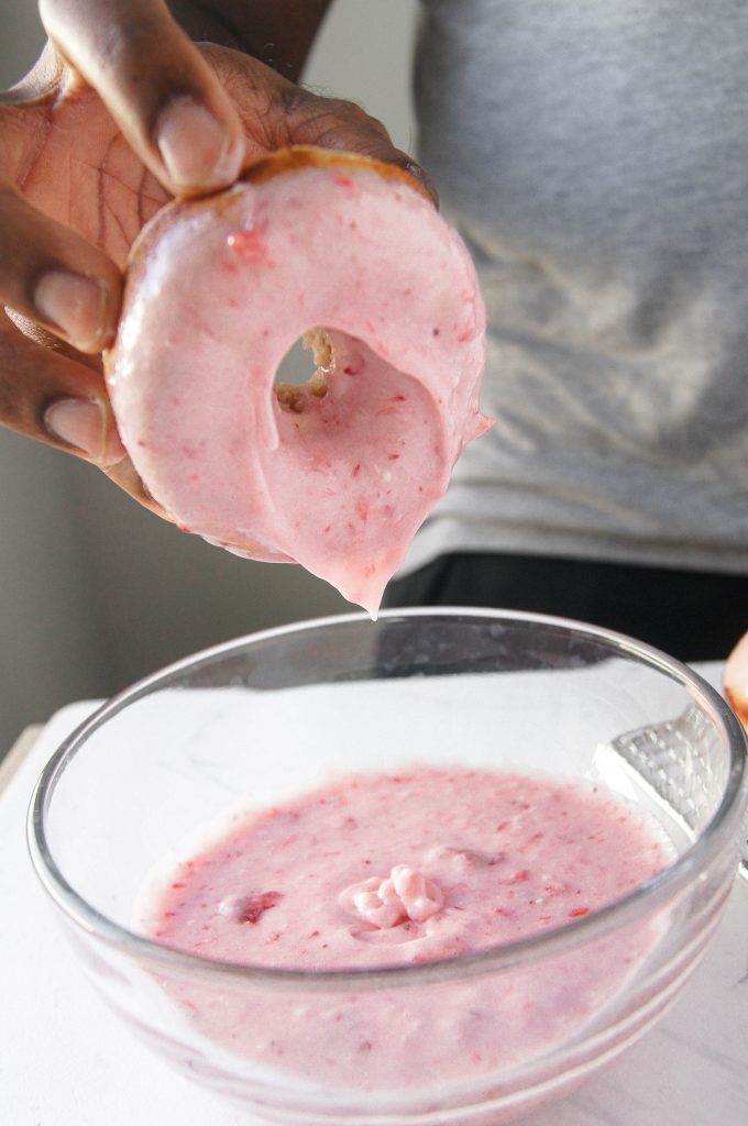 30 Minute Baked Strawberry Donuts dipped in frosting